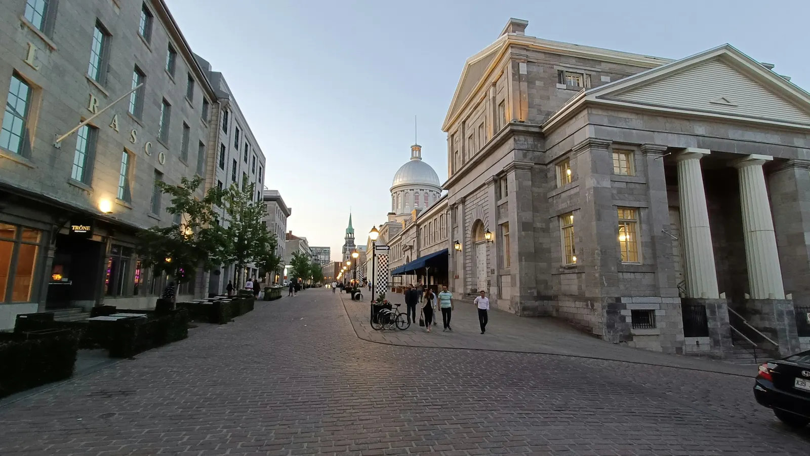Old Montreal street with stone buildings at dusk