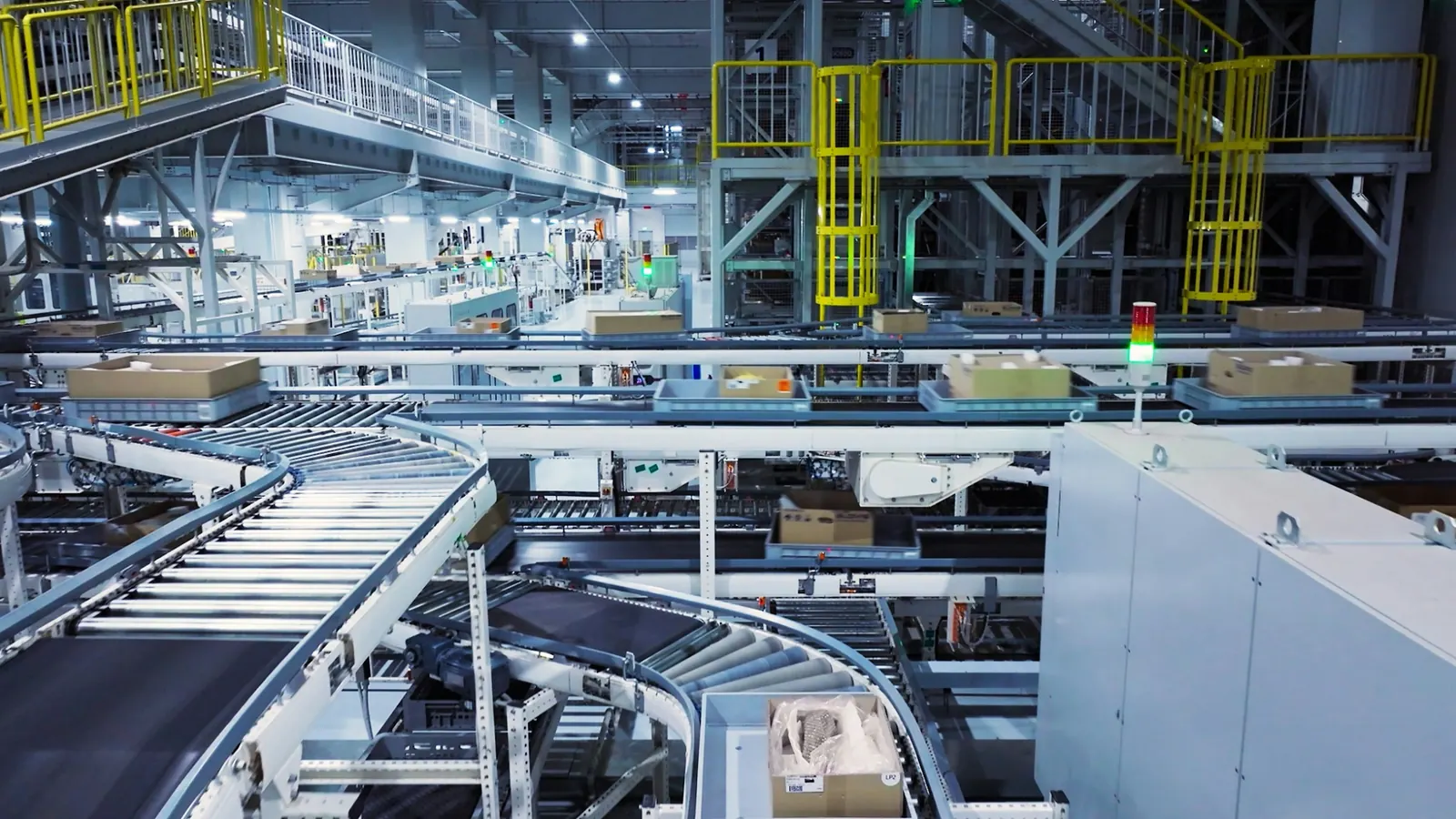 Parcels moving along conveyor belts in a sorting facility